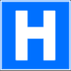 20. Convention on Road Signs and Signals: Traffic Sign E, 13a: Hospital (white letter H on blue ground)